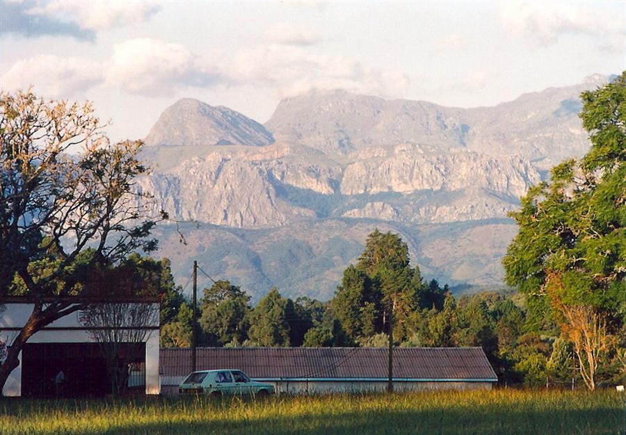 Chimanimani village with the Eastern Highlands mountains rising behind it in evening light