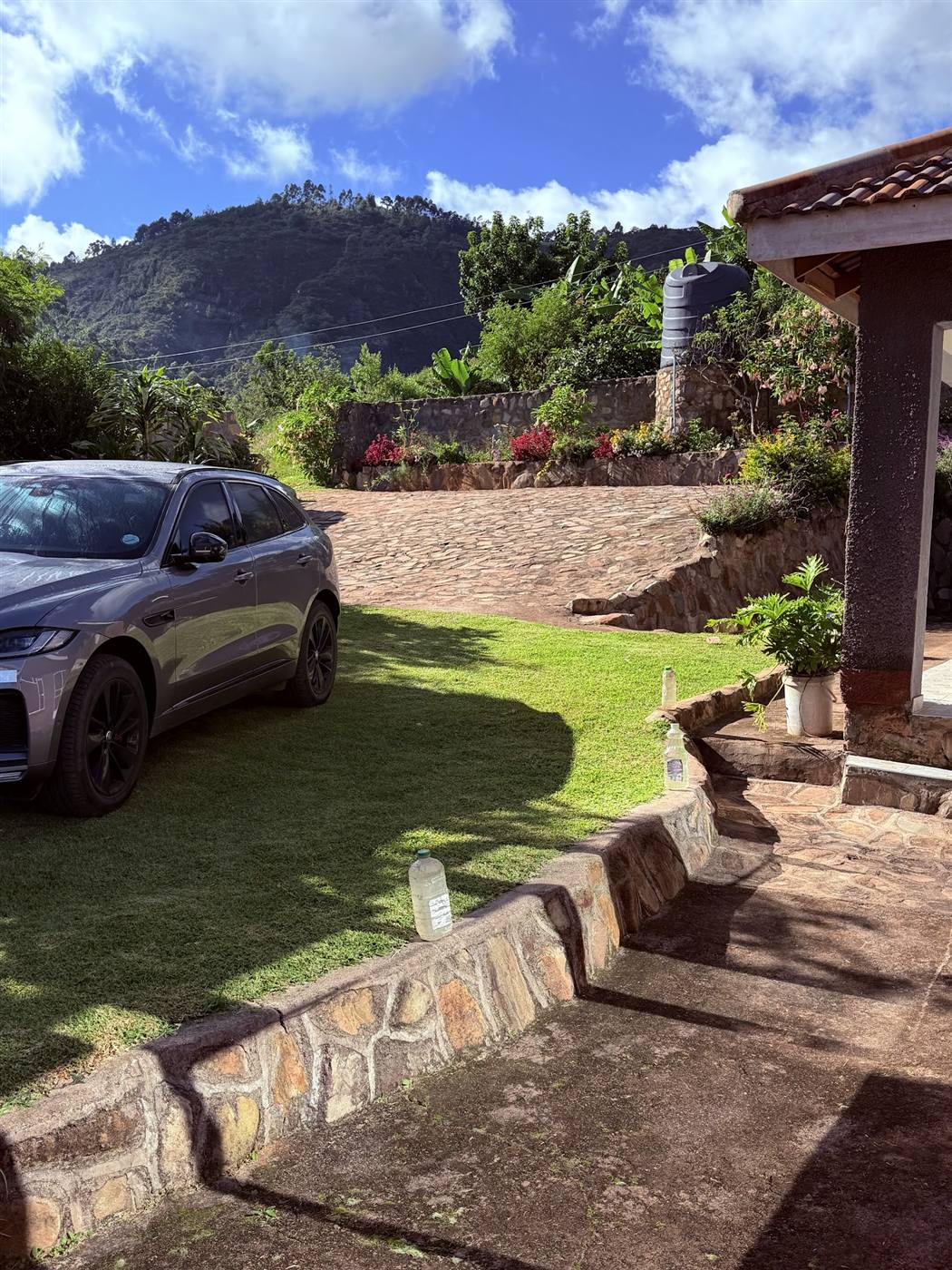 Terraced gardens, stone walls and cobbled driveway at Eland Sanctuary B&B, Chimanimani